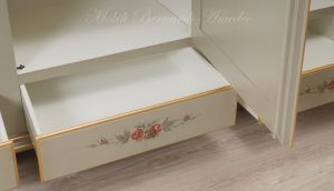 Hand-lacquered wood wardrobe with floral decorations and gold leaf