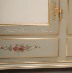 Hand-lacquered wood wardrobe with floral decorations and gold leaf