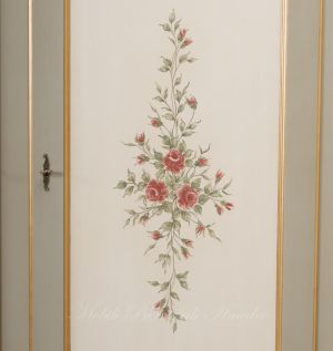 Hand-lacquered wood wardrobe with floral decorations and gold leaf