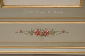 Hand-lacquered wood wardrobe with floral decorations and gold leaf