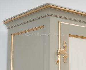 Hand-lacquered wood wardrobe with floral decorations and gold leaf