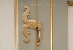Hand-lacquered wood wardrobe with floral decorations and gold leaf