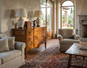 Reproduction of a classic style chest of drawers in inlaid walnut wood placed in a domestic environment