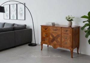 Reproduction of a classic style chest of drawers in inlaid walnut wood placed in a domestic environment