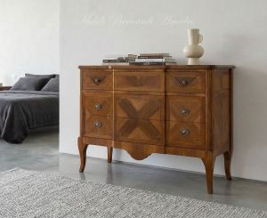 Reproduction of a classic style chest of drawers in inlaid walnut wood placed in a domestic environment