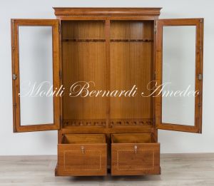 Display case for 12 hunting rifles made of classic style light colored solid wood