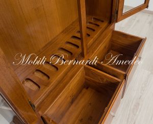 Display case for 12 hunting rifles made of classic style light colored solid wood
