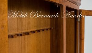 Display case for 12 hunting rifles made of classic style light colored solid wood