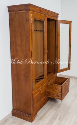 Display case for 12 hunting rifles made of classic style light colored solid wood