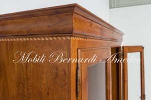 Display case for 12 hunting rifles made of classic style light colored solid wood