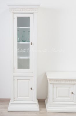 Piccola libreria stile classico contemporaneo con 1 anta chiusa e 1 anta a vetro finitura colore bianco