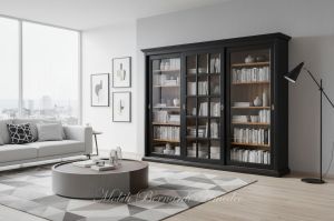 Vetrina libreria inserita in un soggiorno moderno realizzata in legno con 3 ante scorrevoli con vetro