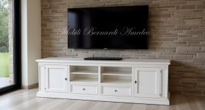 Classic style wooden TV cabinet with antique white finish inserted in a modern home
