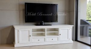 Classic style wooden TV cabinet with antique white finish inserted in a modern home