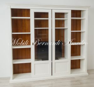 Libreria con ante scorrevoli in legno finitura bicolore con zona porta Tv centrale