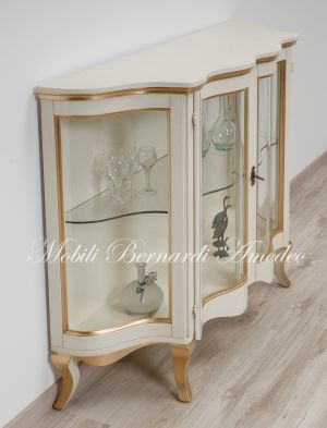 Low shaped showcase with 2 colored wooden doors
