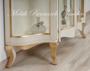 Low shaped showcase with 2 colored wooden doors