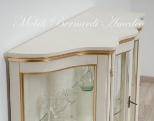 Low shaped showcase with 2 colored wooden doors
