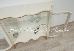 Low shaped showcase with 2 colored wooden doors