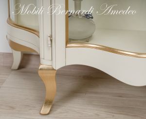 Low shaped showcase with 2 colored wooden doors