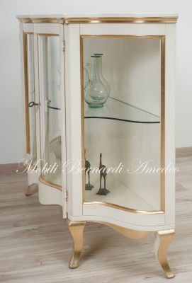 Low shaped showcase with 2 colored wooden doors