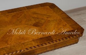 Coffee table with walnut top and turned central leg with white carved legs
