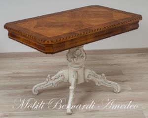 Coffee table with walnut top and turned central leg with white carved legs