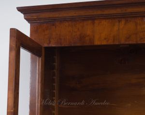 Bookcase built with classic style antique cherry wood with 4 closed doors and 4 glass doors