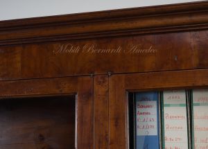 Bookcase built with classic style antique cherry wood with 4 closed doors and 4 glass doors