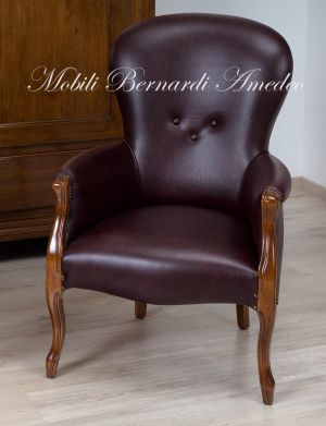 Poltrona imbottita e rivestita in pelle rosso scuro