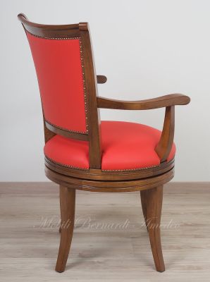Classic style study swivel chair padded and covered with genuine orange Italian leather