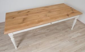 Solid wood table with turned legs and natural oak top with hand-planed knots
