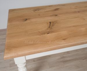 Solid wood table with turned legs and natural oak top with hand-planed knots