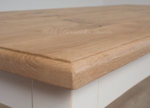 Solid wood table with turned legs and natural oak top with hand-planed knots