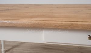 Solid wood table with turned legs and natural oak top with hand-planed knots