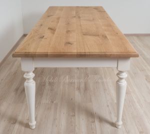 Solid wood table with turned legs and natural oak top with hand-planed knots