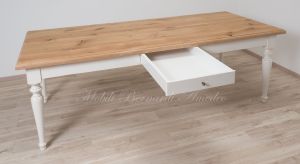 Country style wooden table with top in planed solid oak with knots and antique white turned legs