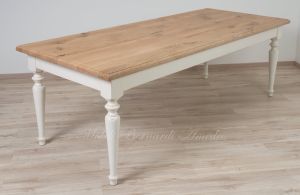 Country style wooden table with top in planed solid oak with knots and antique white turned legs