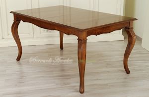 Table with central extensions in walnut