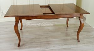 Table with central extensions in walnut