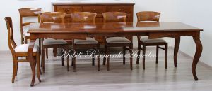 Wooden table with curved legs and barbed top