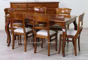 Wooden table with curved legs and barbed top