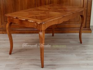 Tavolo in legno di ciliegio con prolunghe centrali
