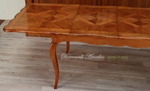 Tavolo in legno di ciliegio con prolunghe centrali