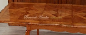 Tavolo in legno di ciliegio con prolunghe centrali