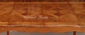Tavolo in legno di ciliegio con prolunghe centrali