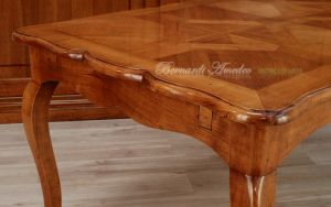 Tavolo in legno di ciliegio con prolunghe centrali