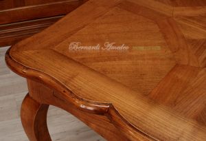 Tavolo in legno di ciliegio con prolunghe centrali