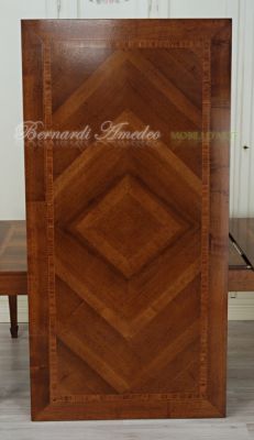 Tavolo in legno con prolunghe piano lavorato