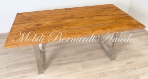 Modern style dining table with light olive wood top and stainless steel legs